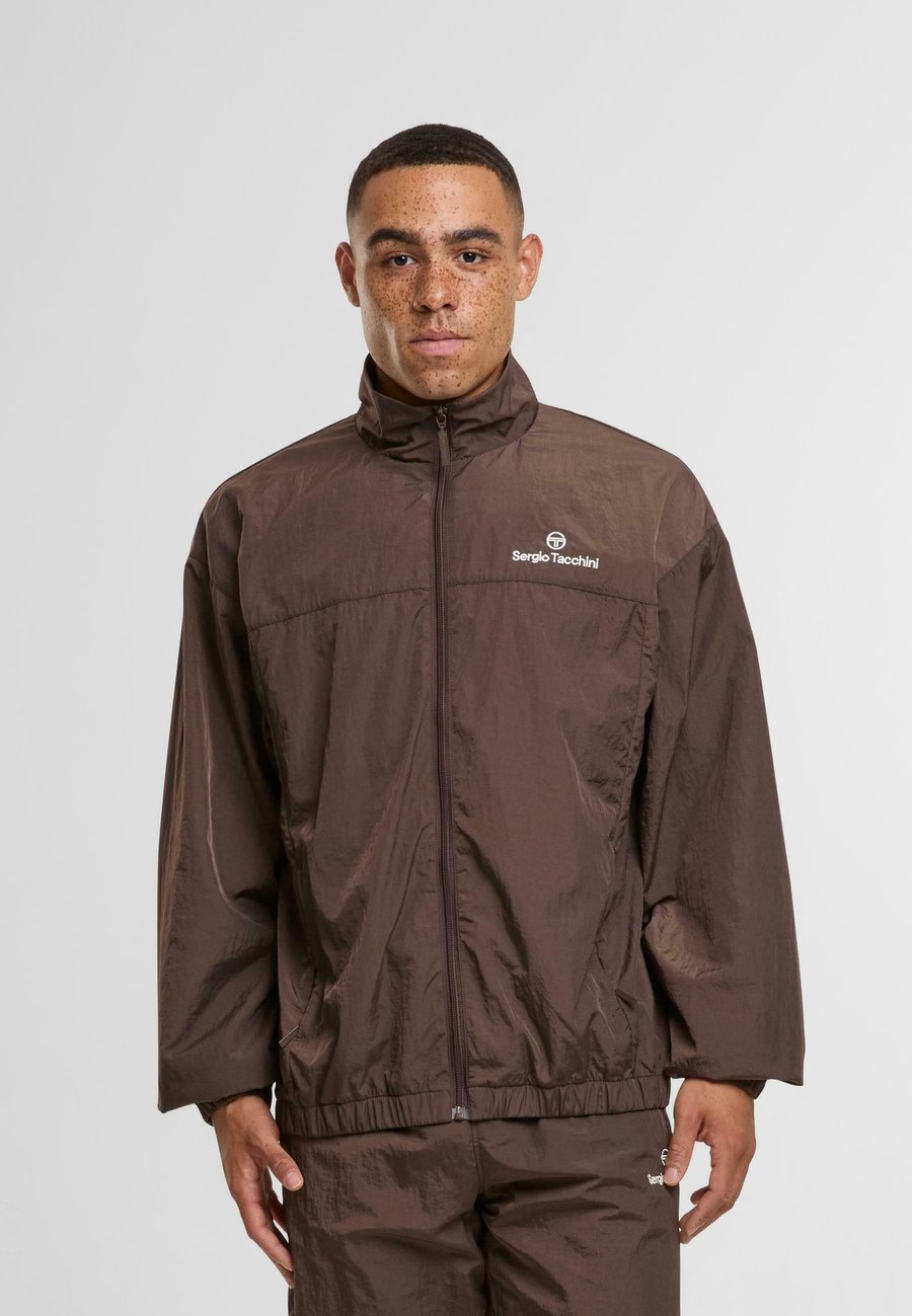 Куртка Sergio Tacchini NAYLA ÜBERGANGSJACKEN, Bracken Gardenia/Brown
Куртка Sergio Tacchini NAYLA ÜBERGANGSJACKEN, Bracken Gardenia/Brown