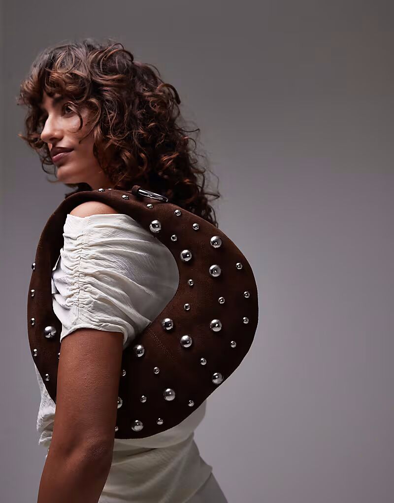 Сумка из кожи Mango с заклепками и колечками коричневого цвета
Сумка из кожи Mango с заклепками и колечками коричневого цвета