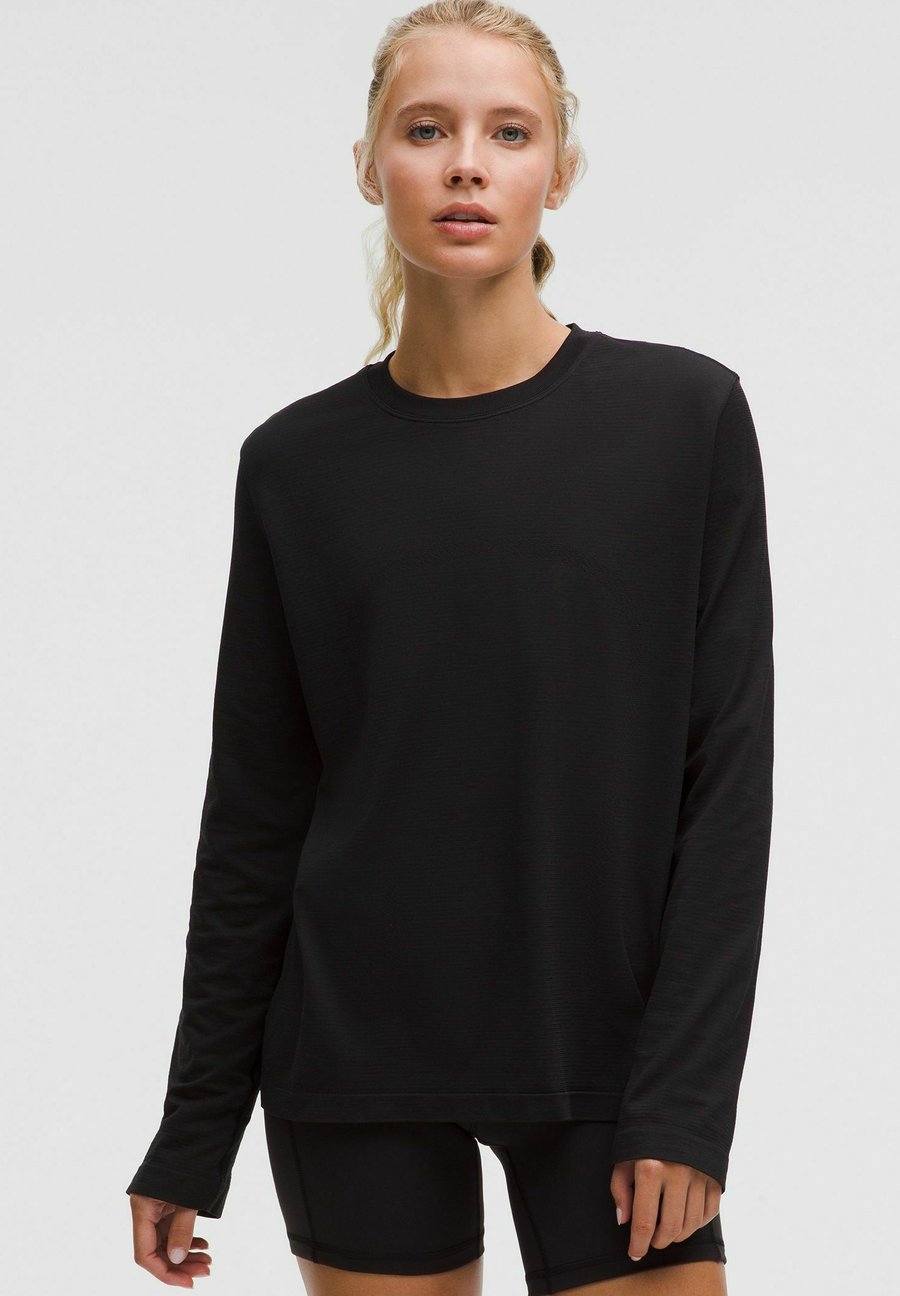 Топ lululemon Swiftly Relaxed Long Sleeve, Black Black/Black
Топ lululemon Swiftly Relaxed Long Sleeve, Black Black/Black