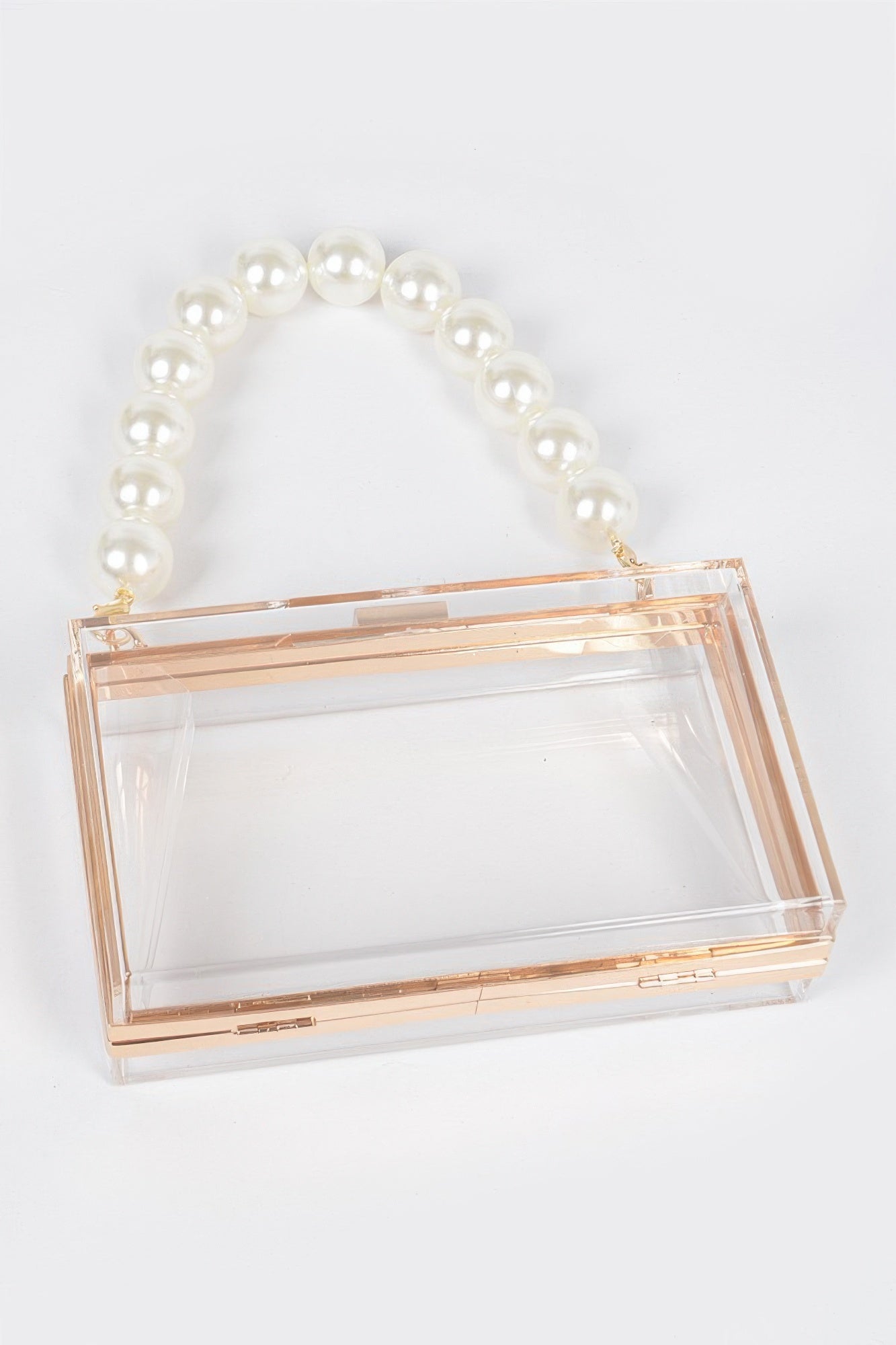 Клатч с жемчужной ручкой и прозрачным корпусом FASHNZFAB, Clear
Клатч с жемчужной ручкой и прозрачным корпусом FASHNZFAB, Clear