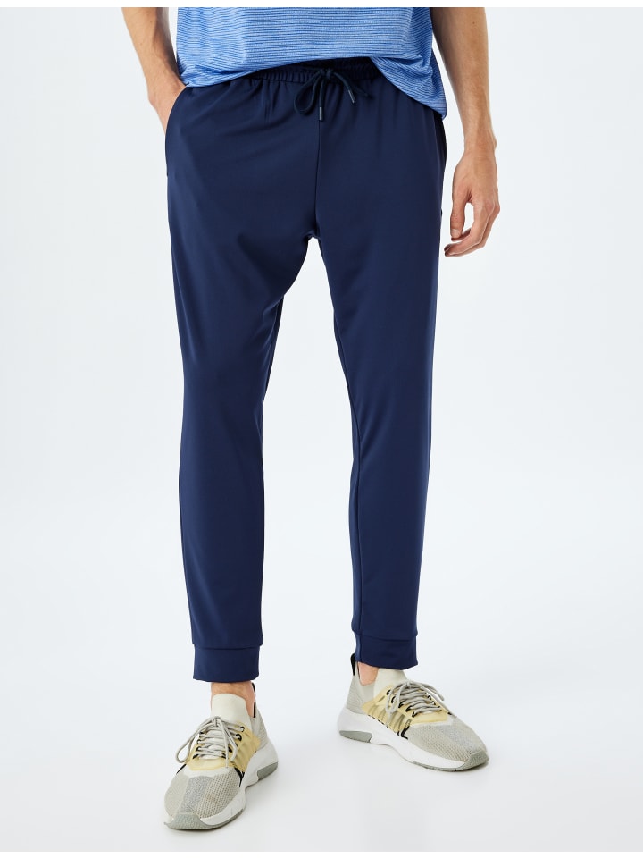 Темно-синие спортивные штаны KOTON
Темно-синие спортивные штаны KOTON