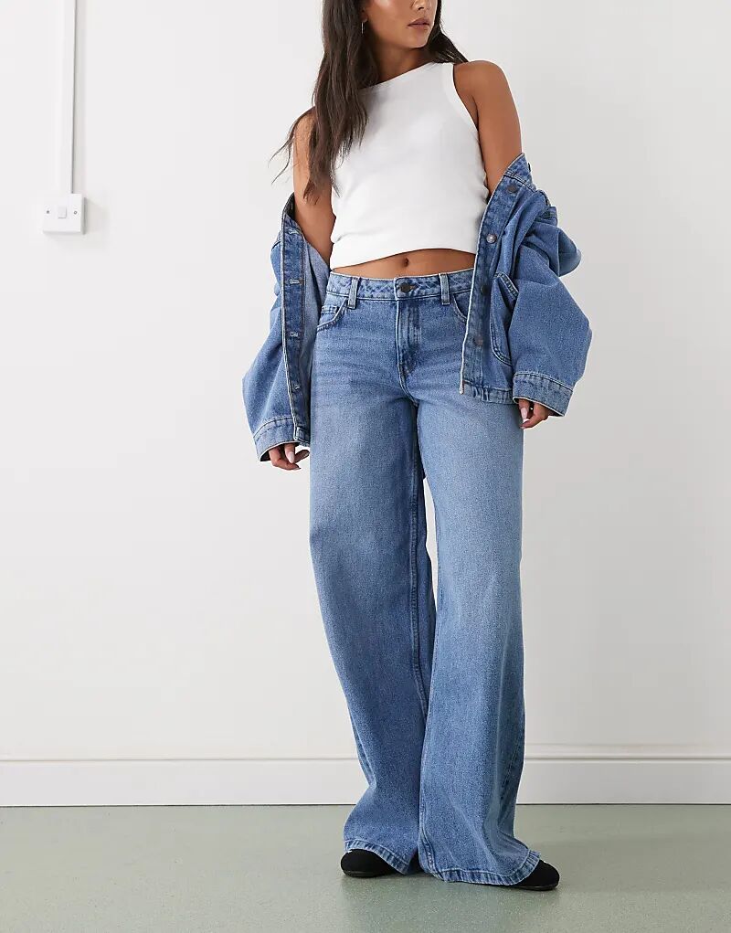 Джинсы Noisy May с низкой посадкой и широкими штанинами из средне-синего денима
Джинсы Noisy May с низкой посадкой и широкими штанинами из средне-синего денима