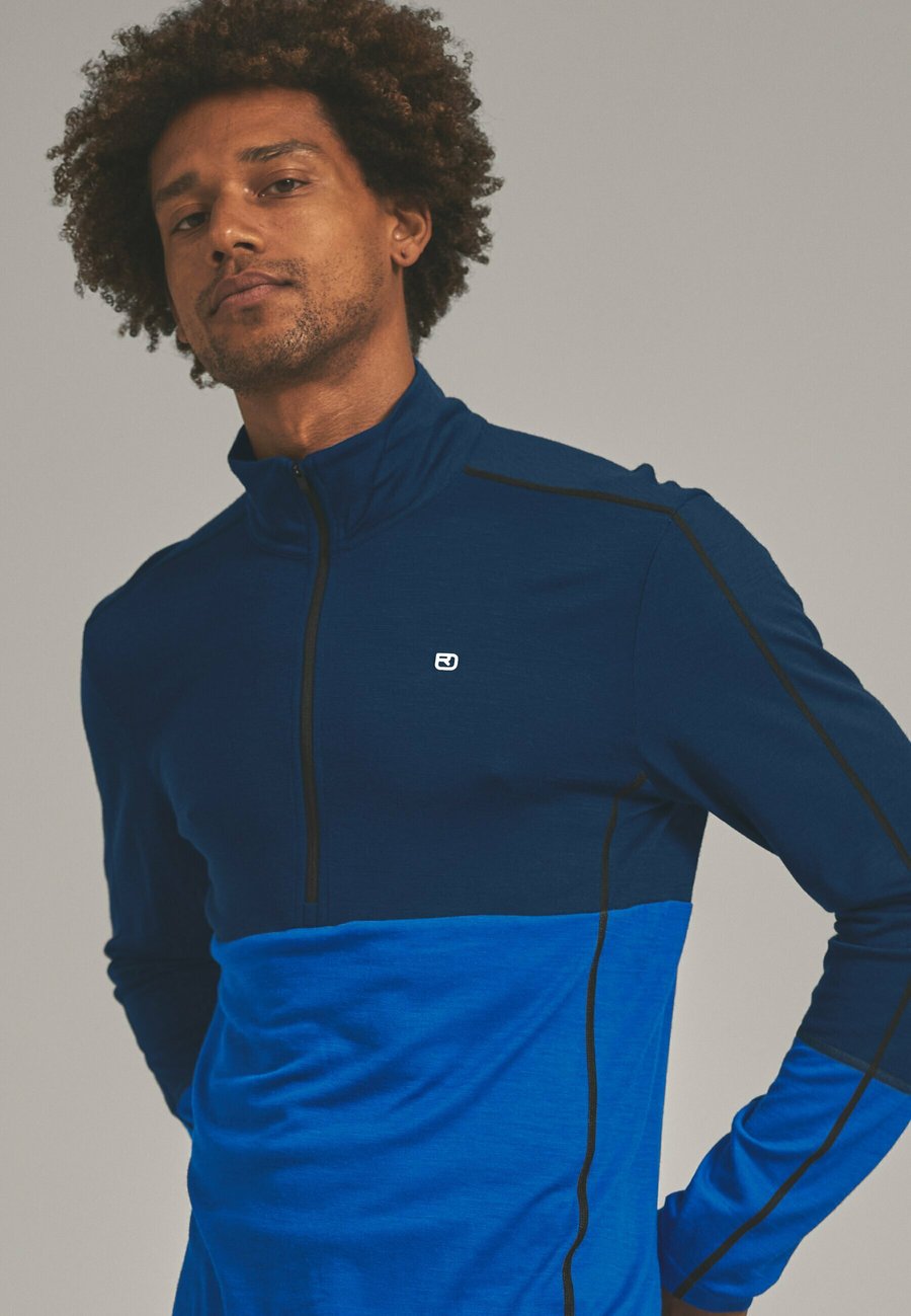 Топ ORTOVOX 185 ROCK'N'WOOL ZIP NECK, Deep Ocean/Blue
Топ ORTOVOX 185 ROCK'N'WOOL ZIP NECK, Deep Ocean/Blue