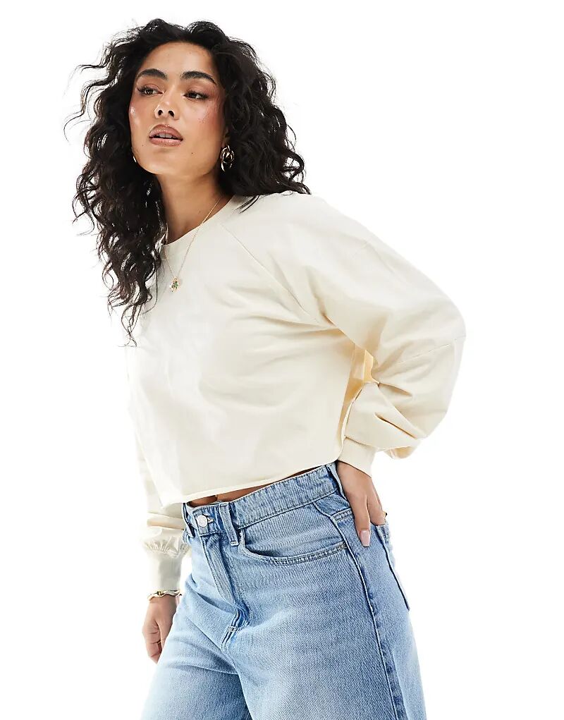 Укороченная футболка с длинными рукавами в кремово-белом цвете Monki
Укороченная футболка с длинными рукавами в кремово-белом цвете Monki