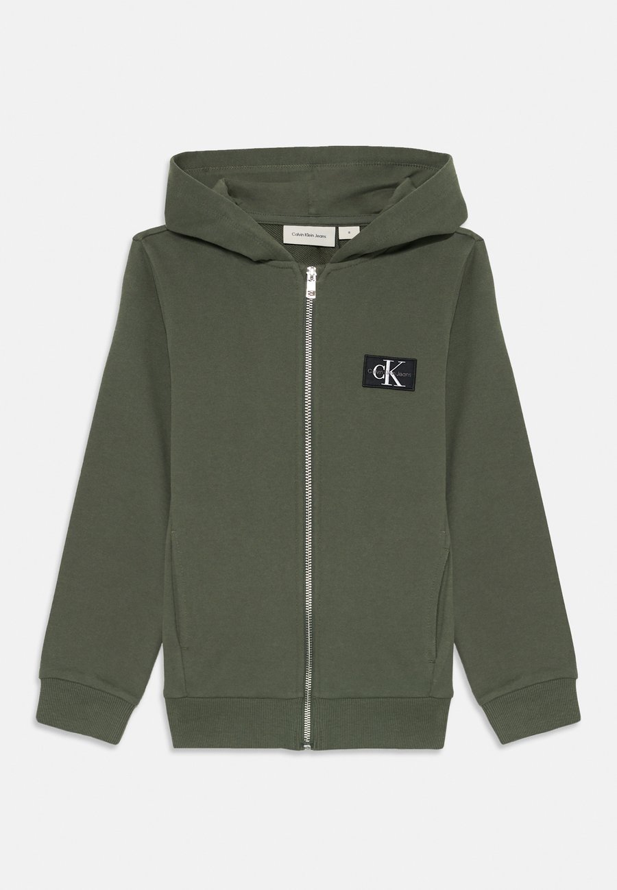 Толстовка Calvin Klein Jeans BADGE ZIP THROUGH UNISEX, Thyme/Green
Толстовка Calvin Klein Jeans BADGE ZIP THROUGH UNISEX, Thyme/Green