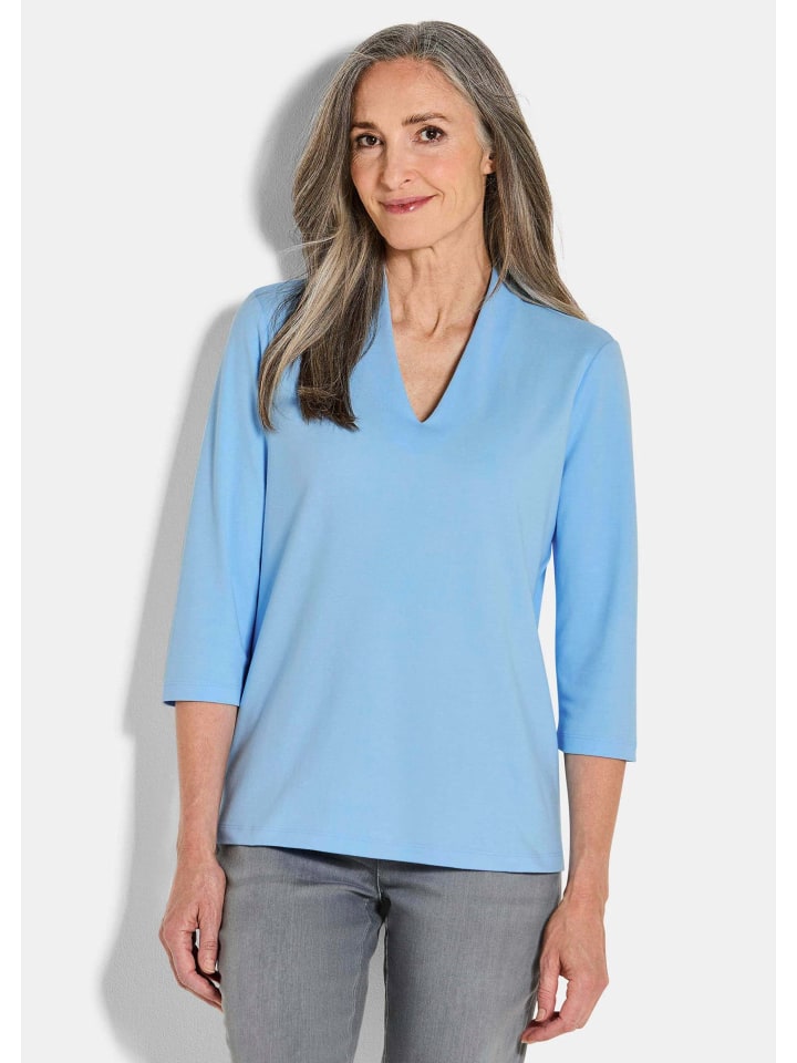 Элегантная базовая рубашка с V-образным вырезом светло-голубого цвета GOLDNER
Элегантная базовая рубашка с V-образным вырезом светло-голубого цвета GOLDNER