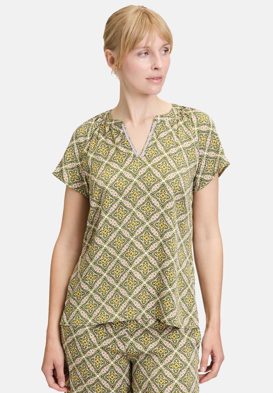 Блуза Cartoon MIT MUSTER, Grün Violett/Green
Блуза Cartoon MIT MUSTER, Grün Violett/Green