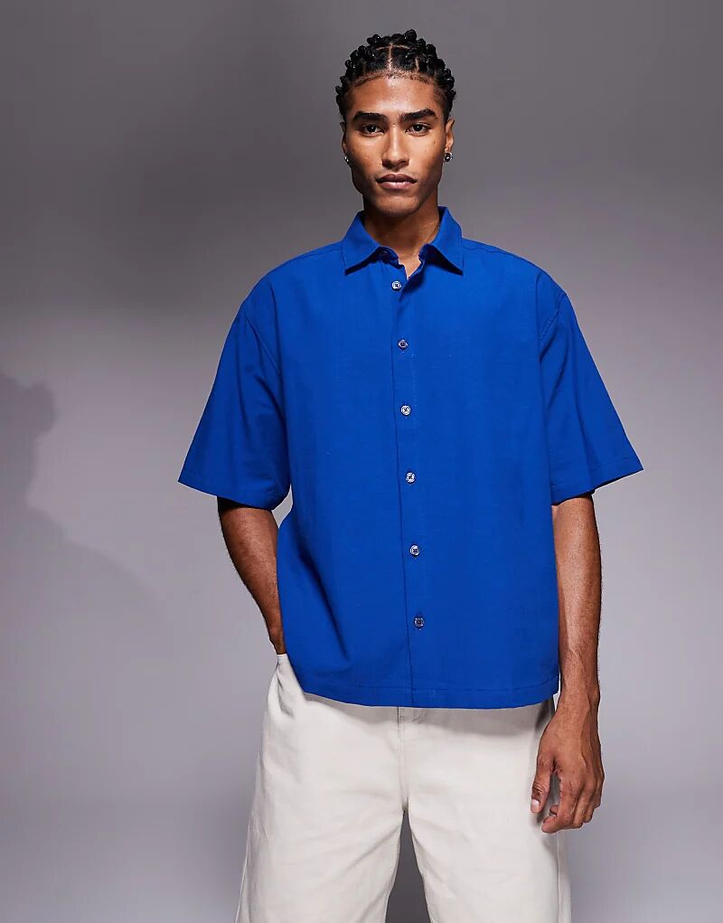 Свободная рубашка ASOS DESIGN синего цвета с вышивкой на спине
Свободная рубашка ASOS DESIGN синего цвета с вышивкой на спине