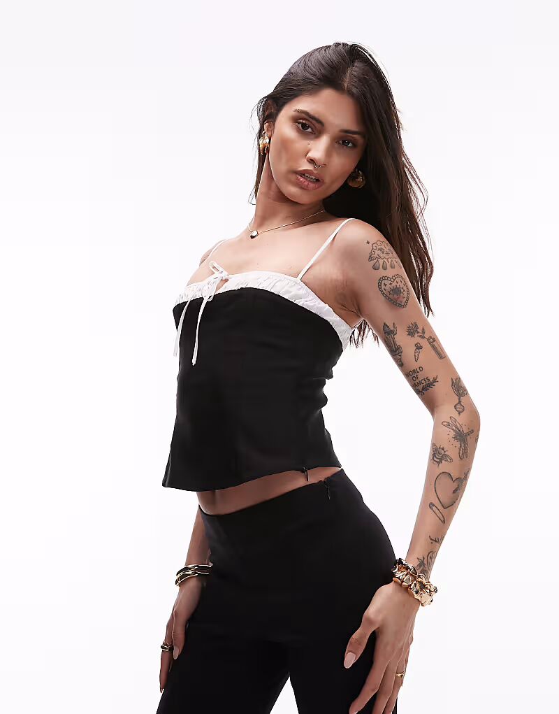 Топ Nia maria с бантом черного цвета
Топ Nia maria с бантом черного цвета