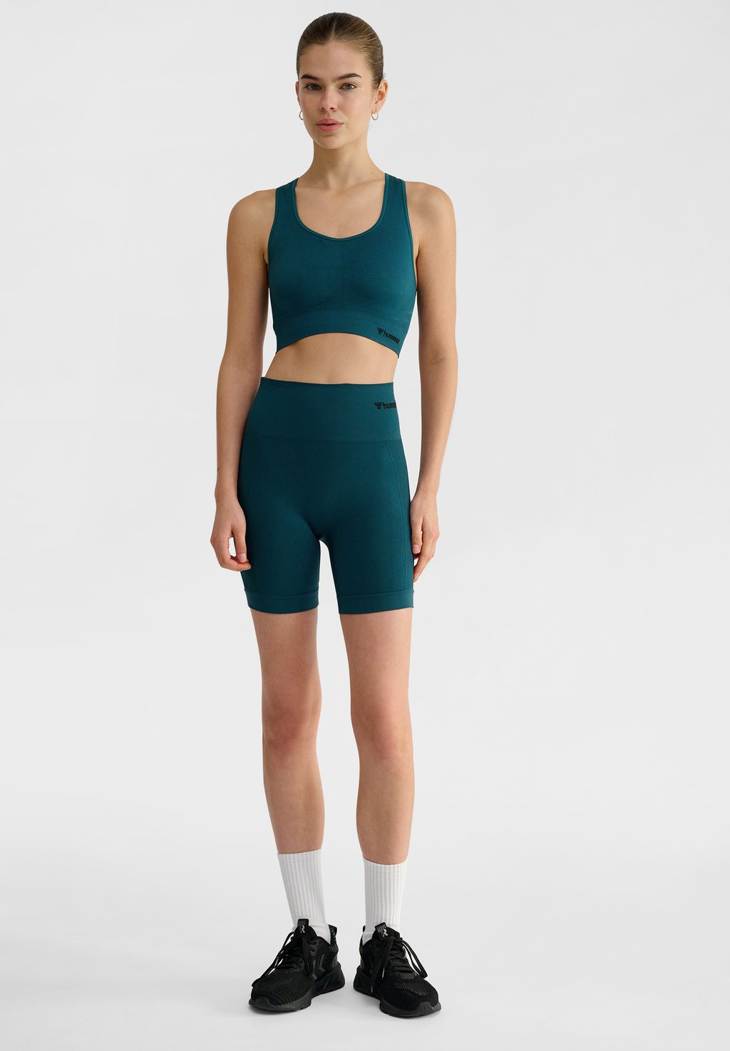 Спортивный бюстгальтер SEAMLESS Hummel, темно-синий 
Спортивный бюстгальтер SEAMLESS Hummel, темно-синий