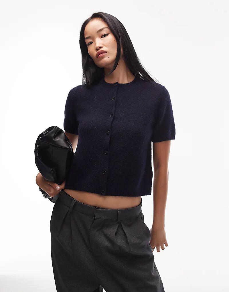 Вязаный кардиган ARKET из смеси альпаки с короткими рукавами темно-синего цвета
Вязаный кардиган ARKET из смеси альпаки с короткими рукавами темно-синего цвета