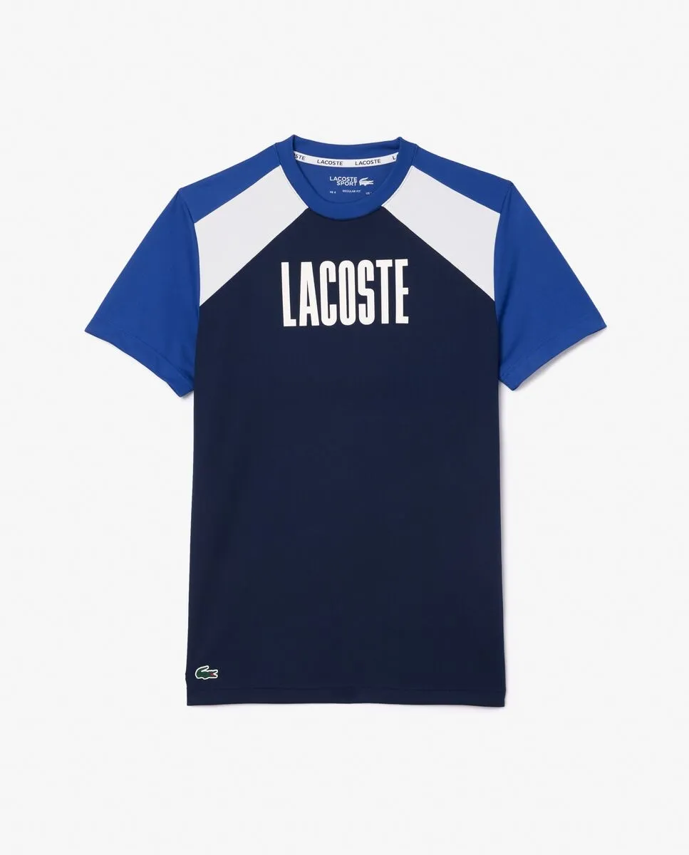 Мужская синяя спортивная футболка с коротким рукавом в стиле колор-блок Lacoste, тёмно-синий
Мужская синяя спортивная футболка с коротким рукавом в стиле колор-блок Lacoste, тёмно-синий