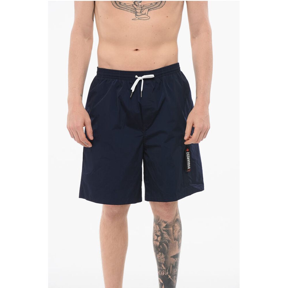 Однотонные нейлоновые шорты для плавания с затягивающейся талией Dsquared2, синий
Однотонные нейлоновые шорты для плавания с затягивающейся талией Dsquared2, синий