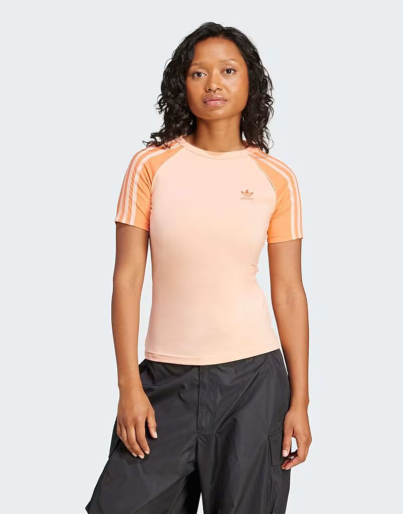 Футболка Adidas Originals Adicolor с тремя полосками и рукавами реглан в ярко-розовом цвете
Футболка Adidas Originals Adicolor с тремя полосками и рукавами реглан в ярко-розовом цвете