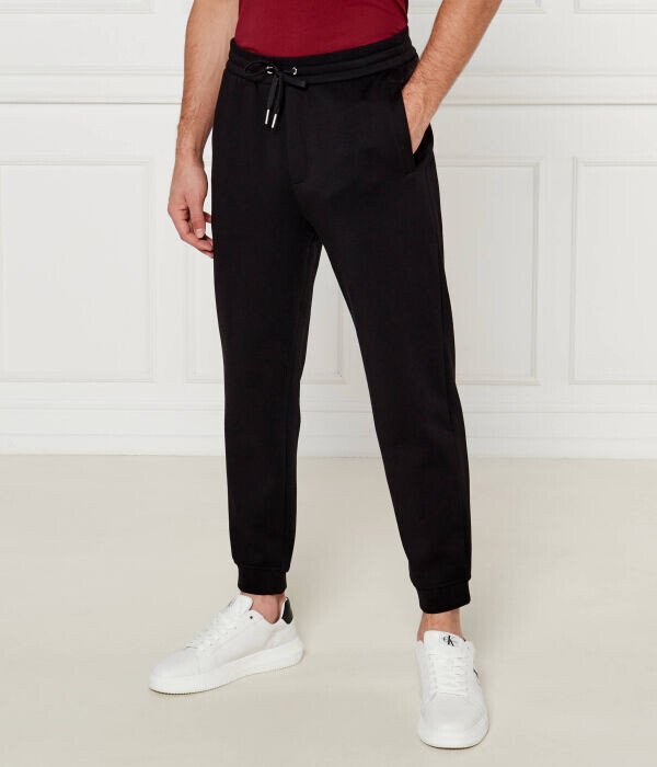 Спортивные штаны мужские Armani Exchange зауженные, черный 
Спортивные штаны мужские Armani Exchange зауженные, черный