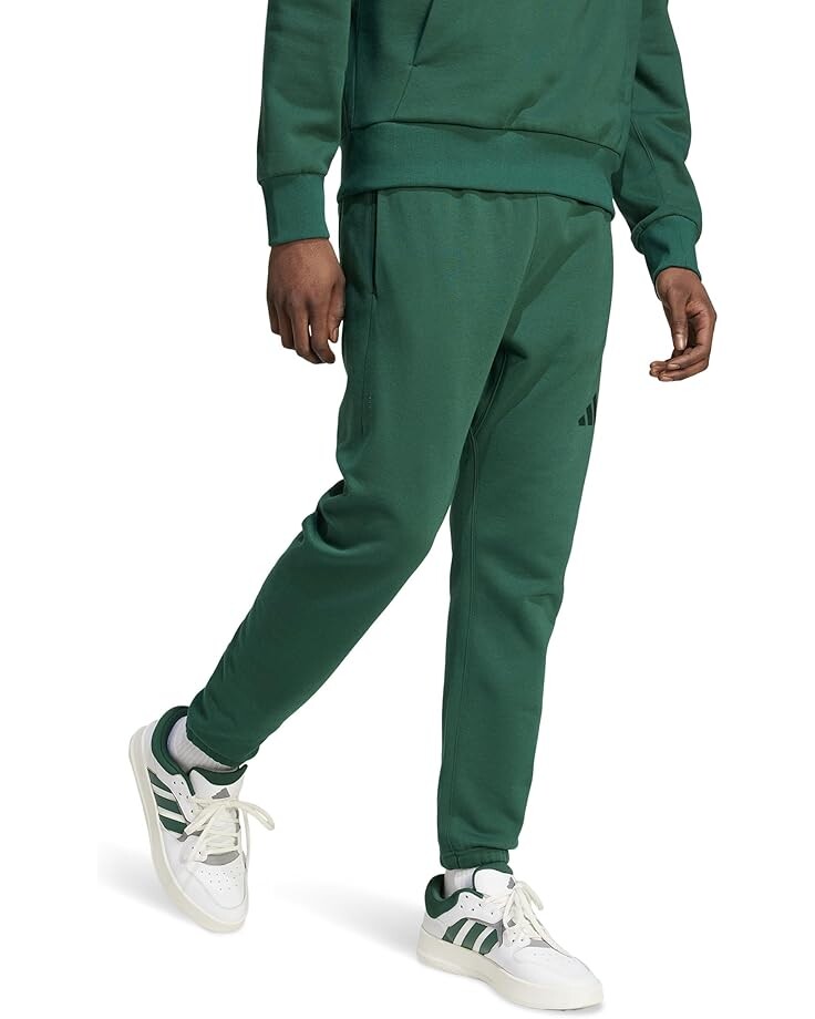 Брюки adidas All SZN Fleece Regular Tapered Pant, цвет Collegiate Green 
Брюки adidas All SZN Fleece Regular Tapered Pant, цвет Collegiate Green