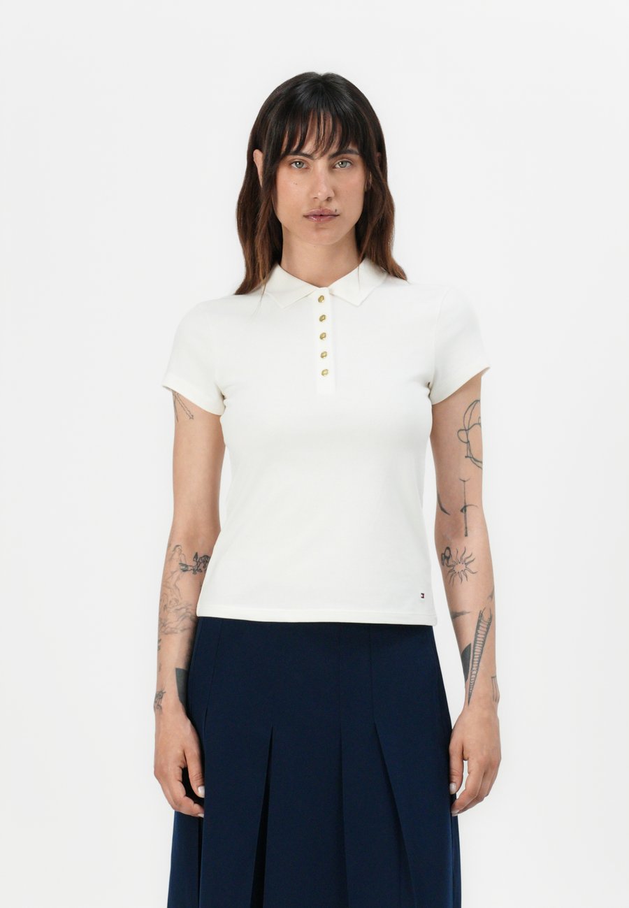 Поло Tommy Hilfiger GOLD BUTTON SLIM POLO, Ivory Silk/Off-White
Поло Tommy Hilfiger GOLD BUTTON SLIM POLO, Ivory Silk/Off-White