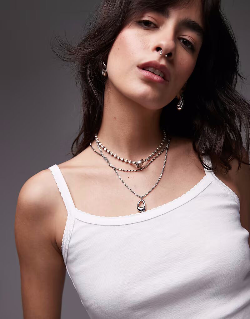 Топ Topshop с отделкой в виде фестончатого узора белого цвета
Топ Topshop с отделкой в виде фестончатого узора белого цвета