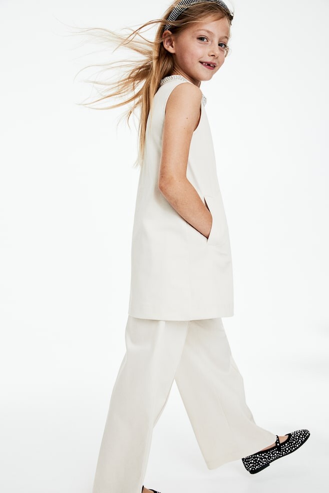 Платье а силуэта со стразами H&M, бежевый
Платье а силуэта со стразами H&M, бежевый