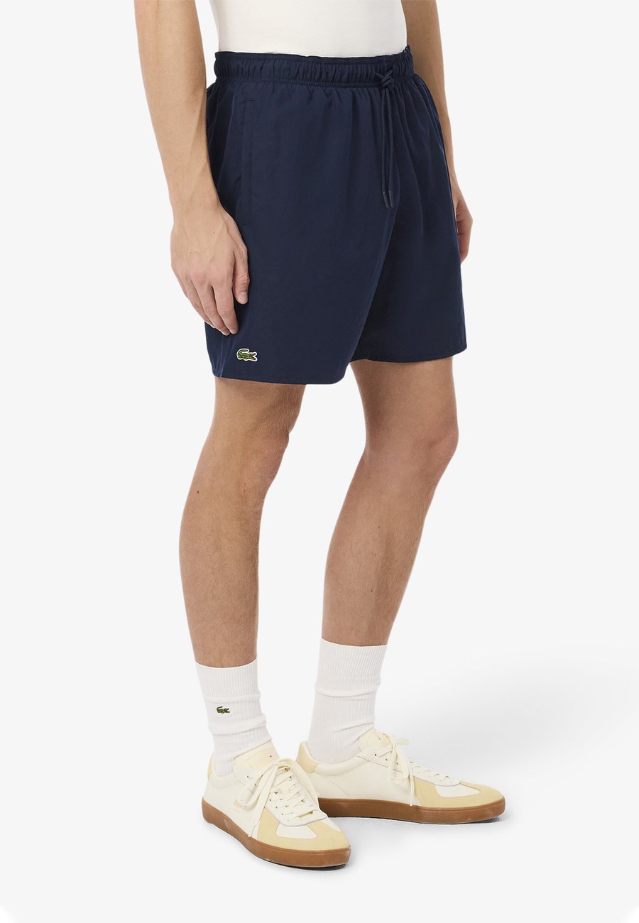 Шорты для плавания Lacoste Swimming shorts, Bleu Marine Vert/Blue
Шорты для плавания Lacoste Swimming shorts, Bleu Marine Vert/Blue