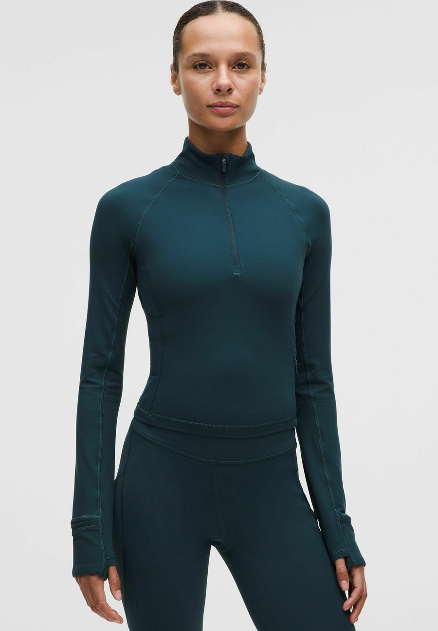 Топ lululemon IT'S RULU CROPPED HALF ZIP, Indochine Blue/Grey
Топ lululemon IT'S RULU CROPPED HALF ZIP, Indochine Blue/Grey