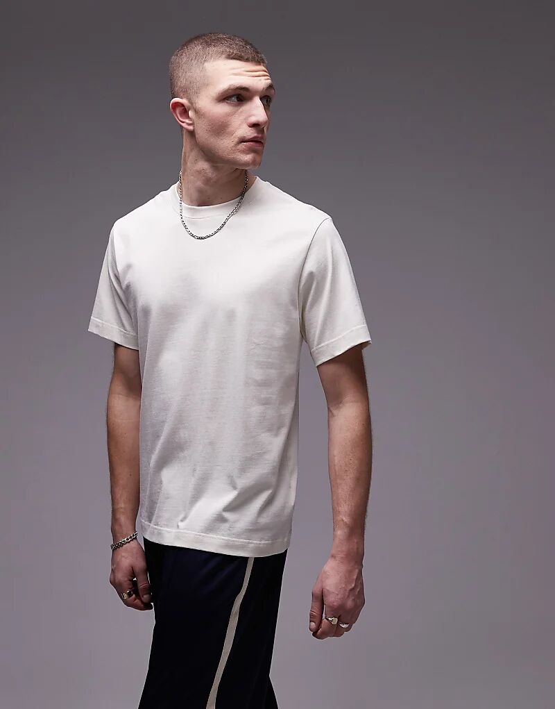 Футболка ARKET из тяжелого джерси цвета «крем»
Футболка ARKET из тяжелого джерси цвета «крем»