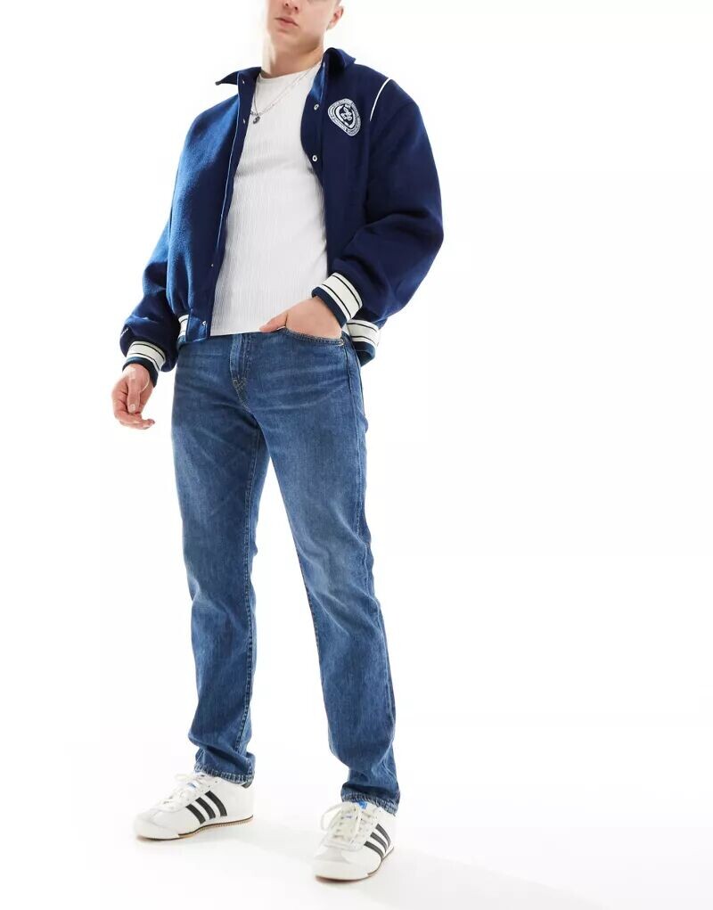 Джинсы узкого кроя Levi's 502 среднего синего цвета
Джинсы узкого кроя Levi's 502 среднего синего цвета