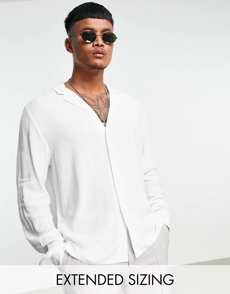 Белая вискозная рубашка свободного кроя с низким воротником ASOS
Белая вискозная рубашка свободного кроя с низким воротником ASOS