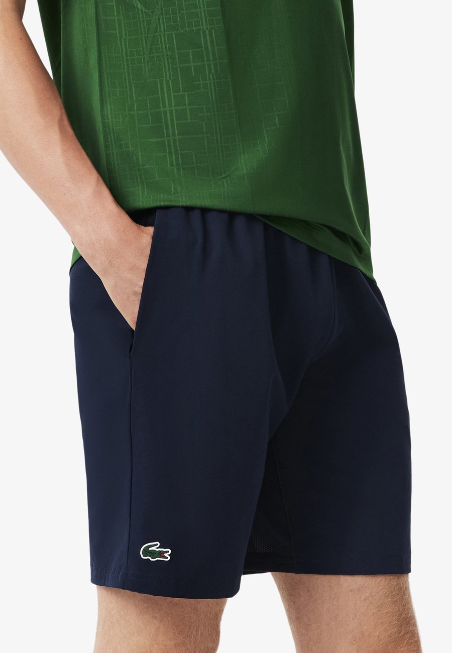 Спортивные шорты Lacoste Sport Sports shorts, Bleu Marine Vert Rij/Dark Blue
Спортивные шорты Lacoste Sport Sports shorts, Bleu Marine Vert Rij/Dark Blue