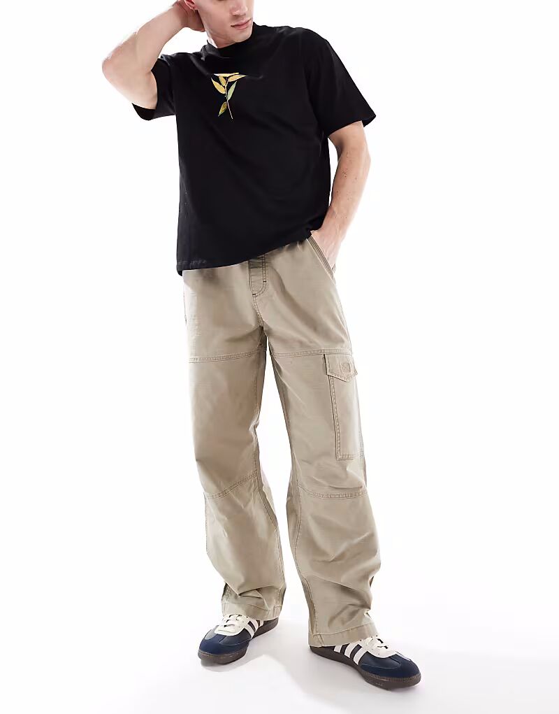 Плотницкие брюки свободного кроя из хлопка Wrangler песочного цвета с завязками
Плотницкие брюки свободного кроя из хлопка Wrangler песочного цвета с завязками