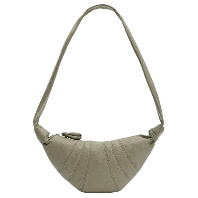 Lemaire Кожаная сумка круассан из серии круассанов Унисекс переносная сумка через плечо наплечная сумка горн хаки зеленый
Lemaire Кожаная сумка круассан из серии круассанов Унисекс переносная сумка через плечо наплечная сумка горн хаки зеленый