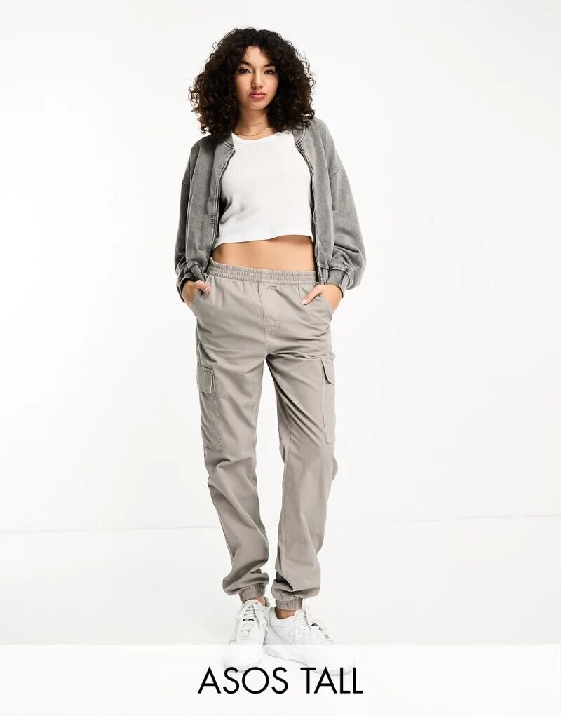 Светло-бежевые брюки карго с манжетами ASOS Tall
Светло-бежевые брюки карго с манжетами ASOS Tall