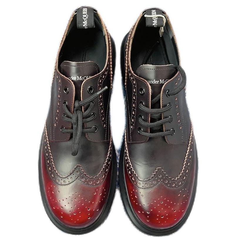 Низкие повседневные кроссовки мужские черные с красным Alexander McQueen
Низкие повседневные кроссовки мужские черные с красным Alexander McQueen