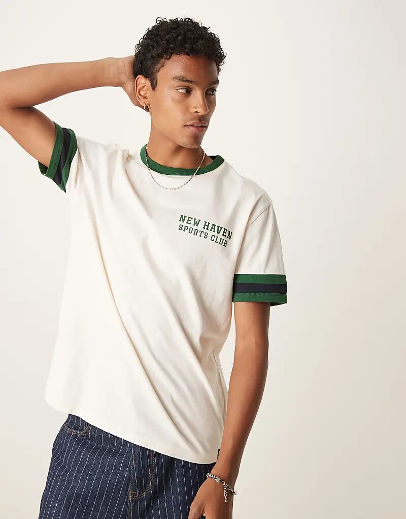 Футболка с графическим принтом GANT в кремовом цвете
Футболка с графическим принтом GANT в кремовом цвете