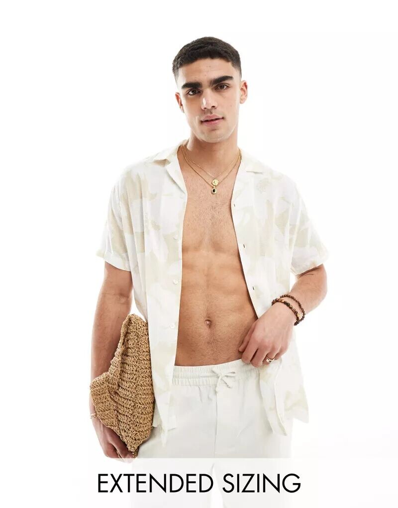 Бежевая рубашка свободного кроя с цветочным принтом и воротником с лацканами ASOS
Бежевая рубашка свободного кроя с цветочным принтом и воротником с лацканами ASOS