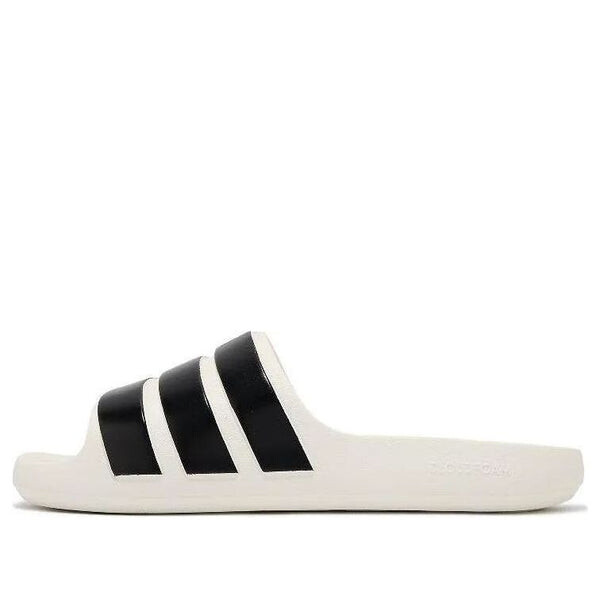 Тапочки adilette flow slides 'white black' Adidas, белый 
Тапочки adilette flow slides 'white black' Adidas, белый