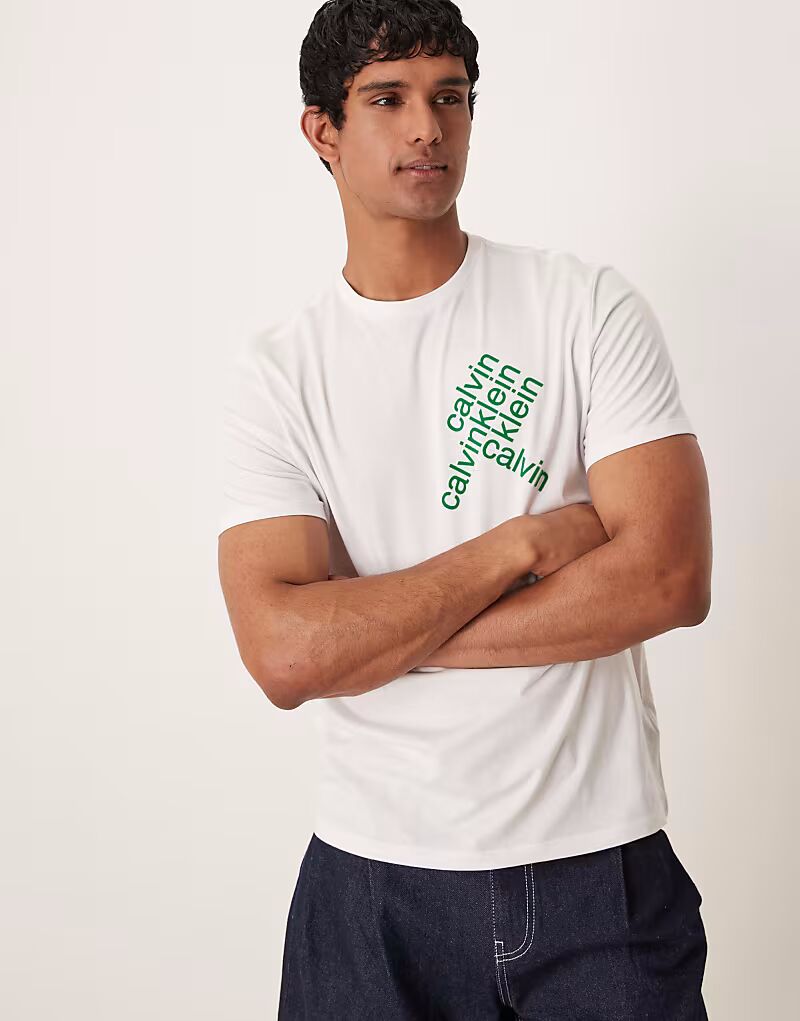 Calvin Klein Jeans - Футболка белого цвета с абстрактным графическим принтом логотипа зеленого цвета
Calvin Klein Jeans - Футболка белого цвета с абстрактным графическим принтом логотипа зеленого цвета