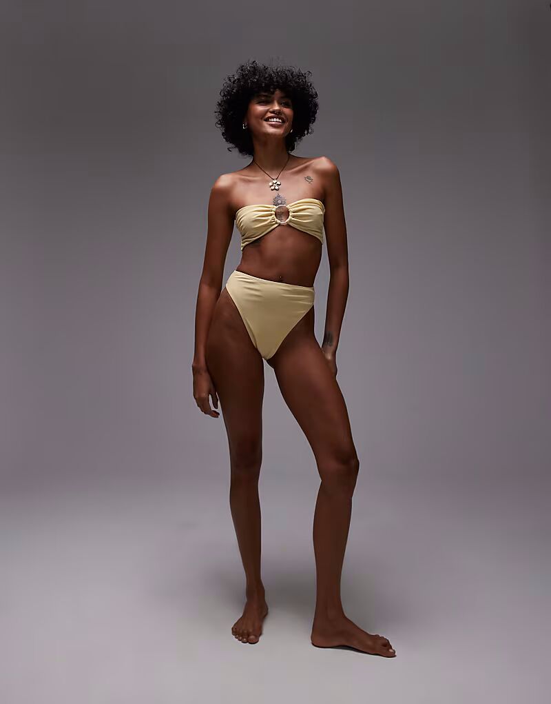 Верх бикини-бандо Thailand с металлической отделкой цвета пахты Topshop
Верх бикини-бандо Thailand с металлической отделкой цвета пахты Topshop