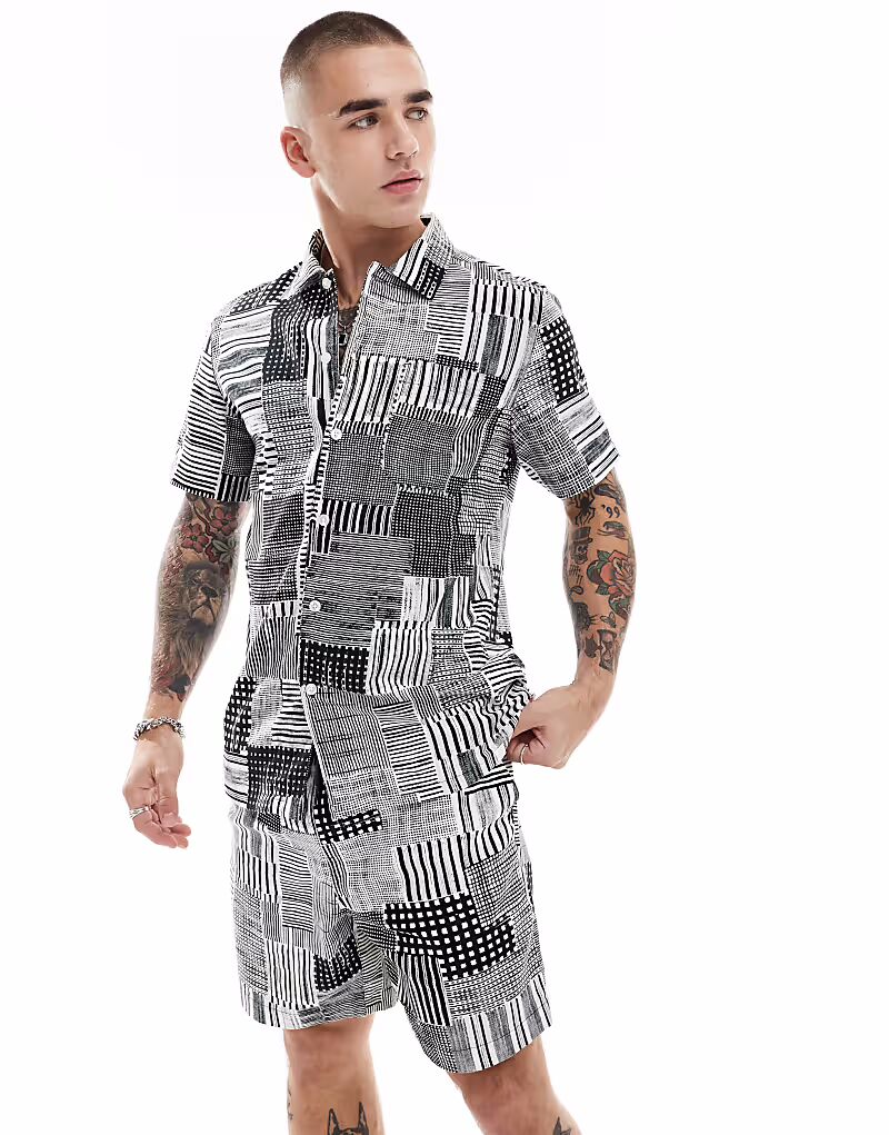 Рубашка с короткими рукавами Chiltern Coord с черно-белым архивным принтом Farah
Рубашка с короткими рукавами Chiltern Coord с черно-белым архивным принтом Farah