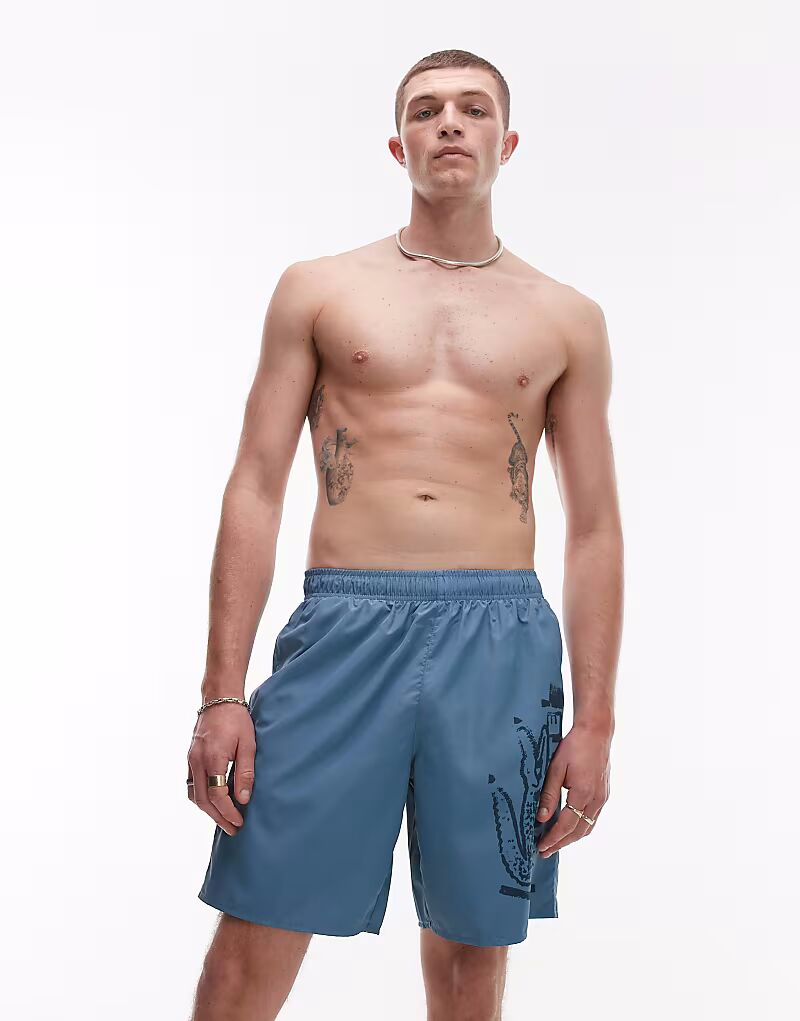 Плавки-шорты Lacoste синего цвета с графическим принтом
Плавки-шорты Lacoste синего цвета с графическим принтом