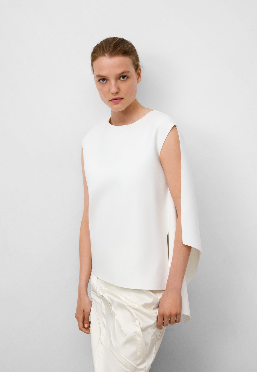 Топ ADOLFO DOMINGUEZ ARMHOLE SLEEVE WITH SIDE GODET , Ecru/Beige
Топ ADOLFO DOMINGUEZ ARMHOLE SLEEVE WITH SIDE GODET , Ecru/Beige