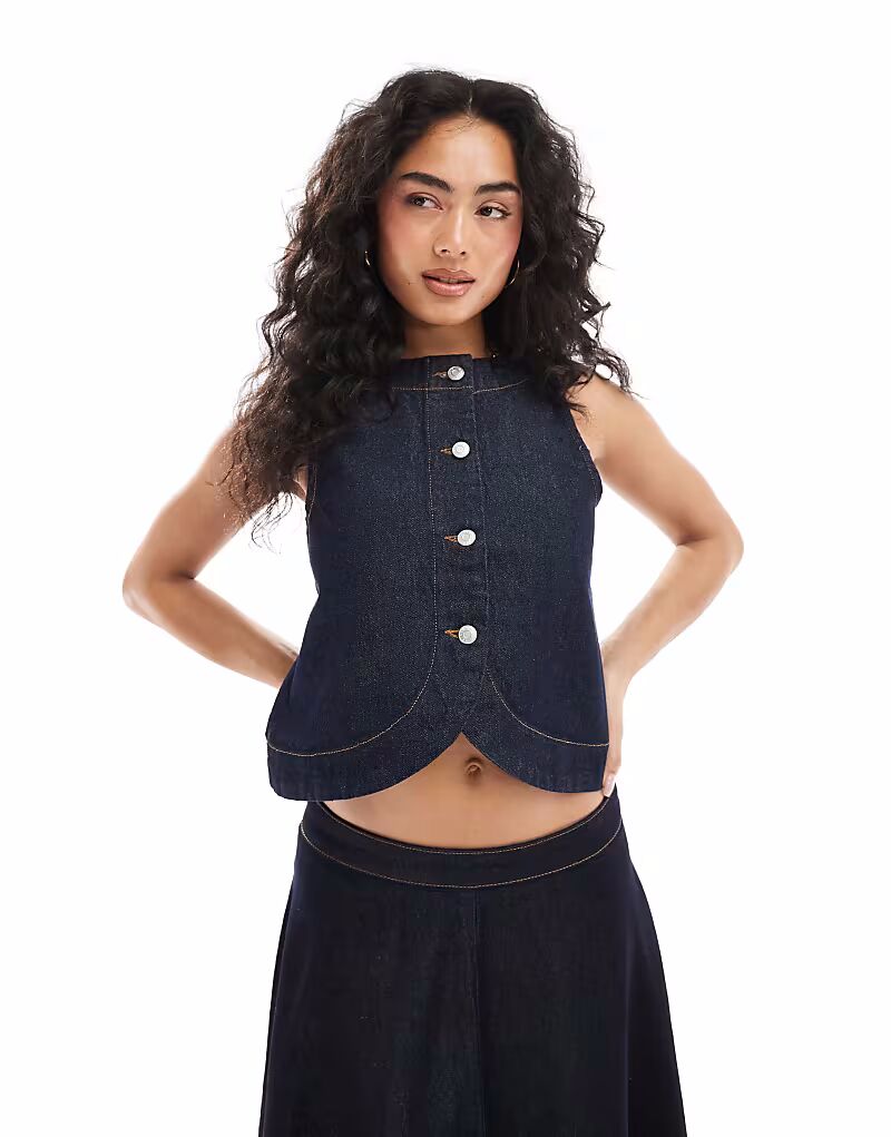 Джинсовый топ ASOS DESIGN с застежкой на пуговицы и закругленным подолом цвета индиго
Джинсовый топ ASOS DESIGN с застежкой на пуговицы и закругленным подолом цвета индиго