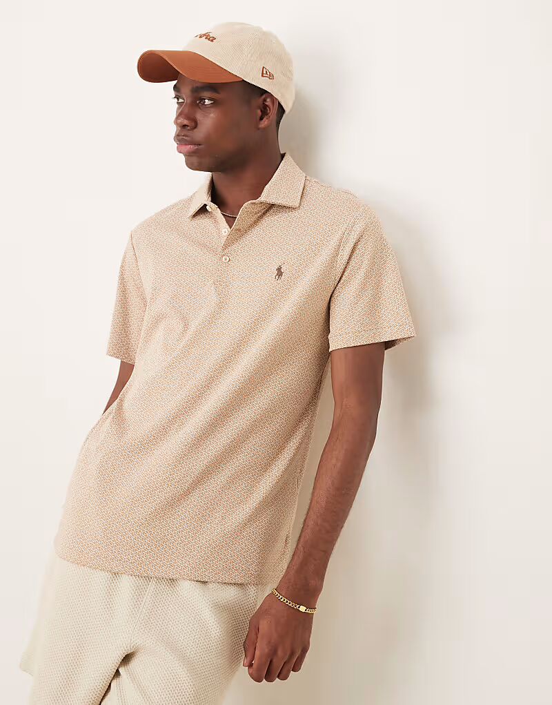 Поло из хлопка пима с принтом подковы и логотипом Polo Ralph Lauren бежевого меланжевого цвета
Поло из хлопка пима с принтом подковы и логотипом Polo Ralph Lauren бежевого меланжевого цвета