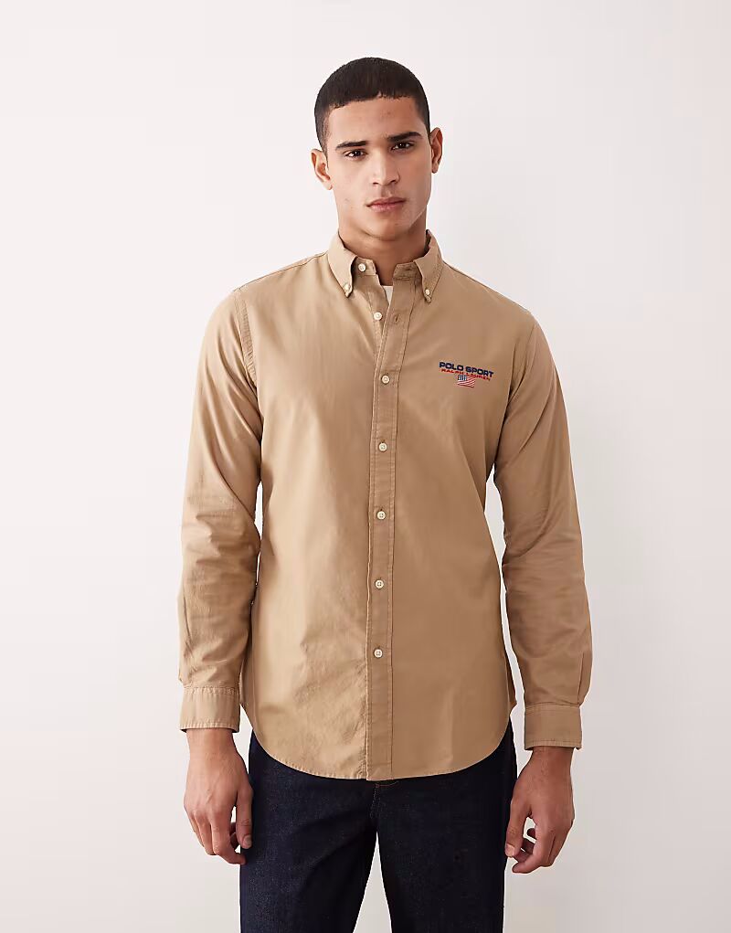 Рубашка оксфорд с логотипом Sport, выполненная по индивидуальному заказу, цвета хаки и бежевого цвета, с небольшим флажком Polo Ralph Lauren
Рубашка оксфорд с логотипом Sport, выполненная по индивидуальному заказу, цвета хаки и бежевого цвета, с небольшим флажком Polo Ralph Lauren