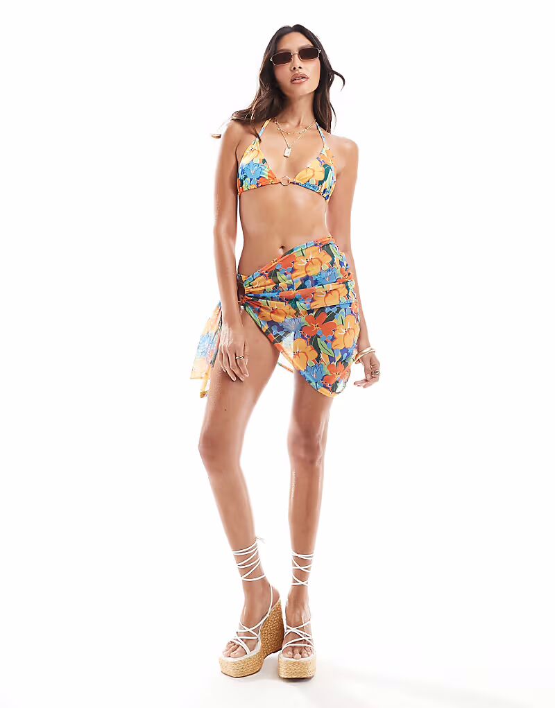 Эксклюзив от Missy Empire - сетчатый саронг с завязками по бокам оранжевого цвета с цветочным принтом, комплект Missyempire
Эксклюзив от Missy Empire - сетчатый саронг с завязками по бокам оранжевого цвета с цветочным принтом, комплект Missyempire