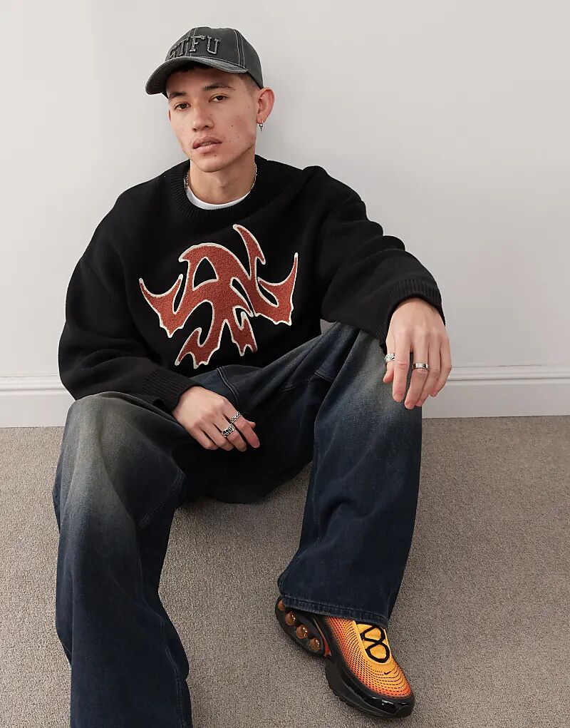 Джемпер оверсайз Cypher с красным жаккардовым рисунком черного цвета Weekday
Джемпер оверсайз Cypher с красным жаккардовым рисунком черного цвета Weekday