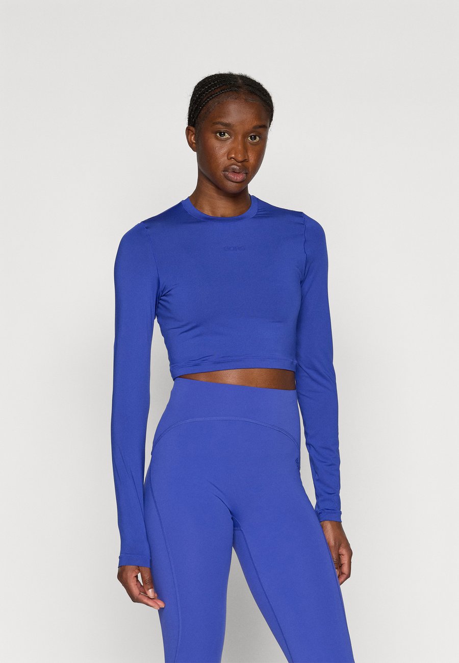 Топ Björn Borg STUDIO SOFT CROPPED LONGSLEEVE, Clematis Blue/Royal Blue
Топ Björn Borg STUDIO SOFT CROPPED LONGSLEEVE, Clematis Blue/Royal Blue