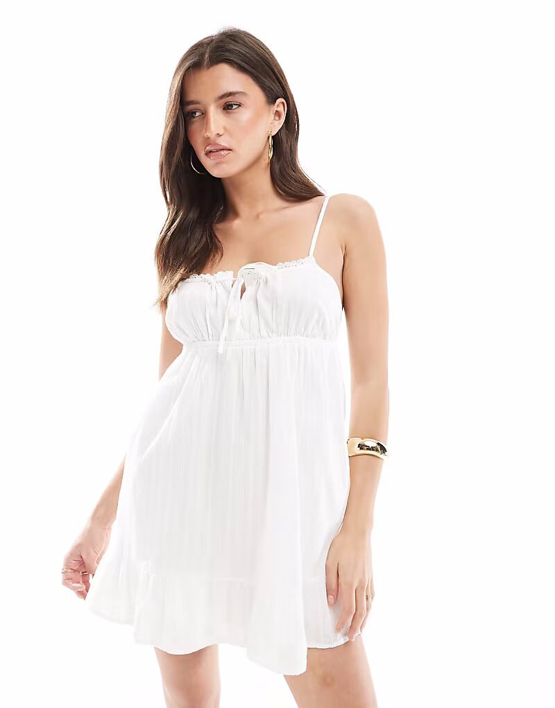 Сарафан мини от Cotton:On Serena белого цвета
Сарафан мини от Cotton:On Serena белого цвета