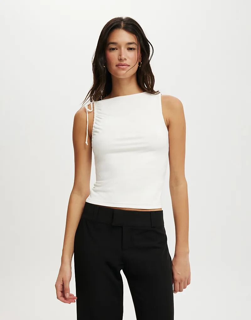 Cotton On Топ Nikki собрала майку в белом цвете
Cotton On Топ Nikki собрала майку в белом цвете