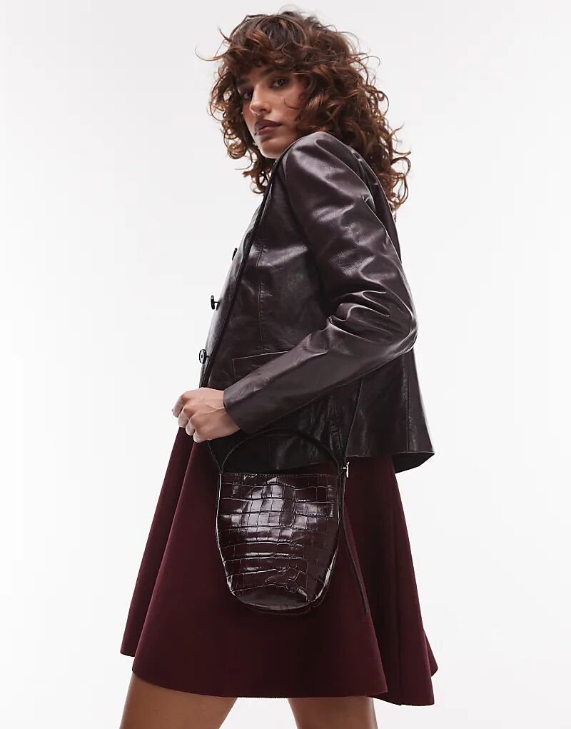 Сумка-ведро ARKET из кожи через плечо со съемными ремнями бордового цвета
Сумка-ведро ARKET из кожи через плечо со съемными ремнями бордового цвета